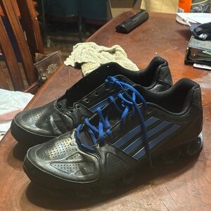 This is a pair of Adidas Nitro FB Bounce running shoes. Black and blue.